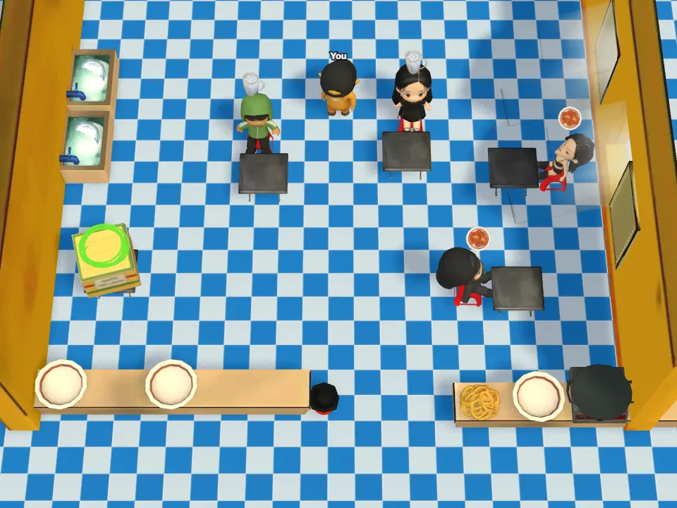 A co-op match in a Bit SaiGon: several chefs working the chopping boards, the stove and the plate counter.
